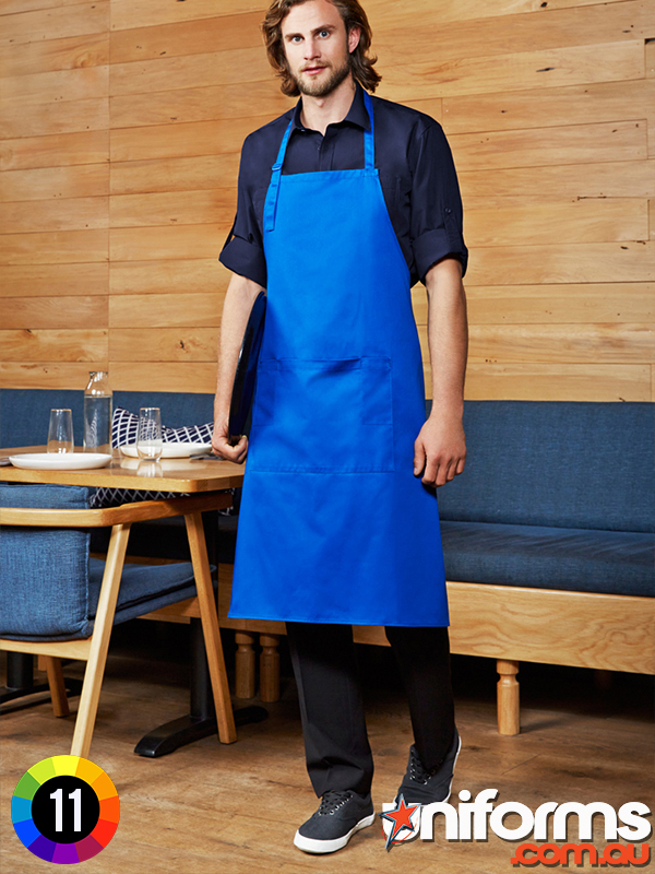  A man in a blue apron stands proudly in a bustling restaurant, showcasing the Biz Collection Urban Bib Apron BA95.