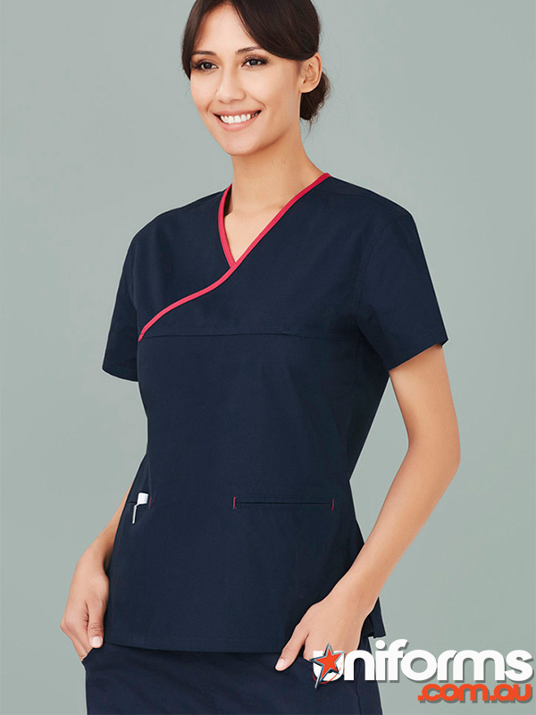 A woman in a navy scrub top with red trim, showcasing the Biz Collection Women’s Contrast Scrub Top H10722.