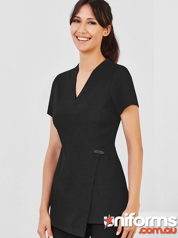 A woman in a black nurse uniform, showcasing the Biz Collection Womens Spa Tunic H630L, exuding professionalism and style