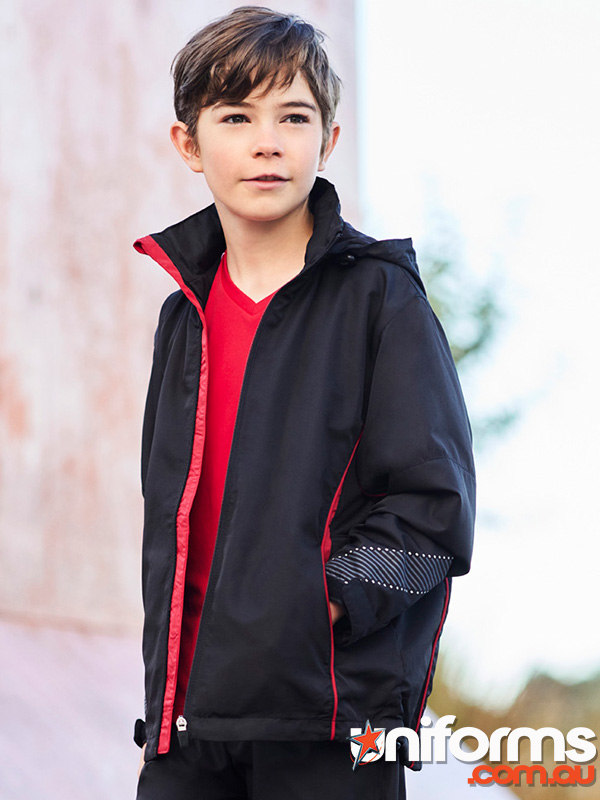A young boy models a black and red Biz Collection Kids Razor Jacket J408K, showcasing a stylish and vibrant look.