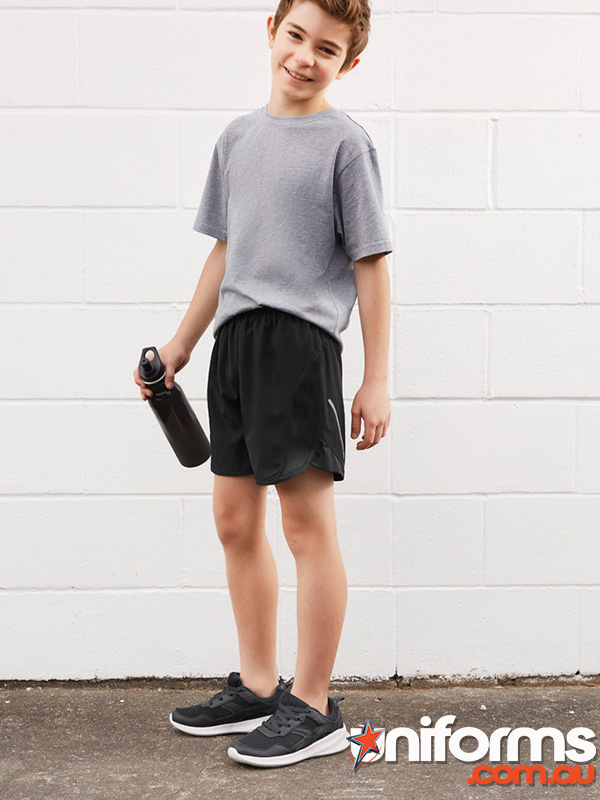 A young boy in a gray shirt and black shorts, showcasing the Biz Collection Kids Tactic Short ST511K)