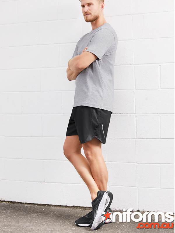 A man wearing black shorts and a grey t-shirt, showcasing Biz Collection Men's Tactic Shorts in a casual setting.