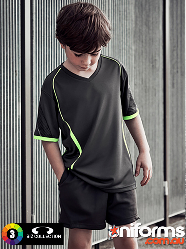 A young boy in a black and green sport uniform, showcasing the Biz Collection Kids Circuit Short (ST711K)