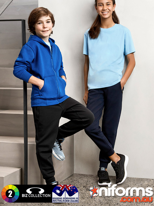 Two children next to stairs, dressed in blue and black clothing, showcasing Biz Collection Kids Neo Pant TP927K.
